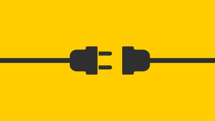 A plug and outlet separated against a bright yellow background.