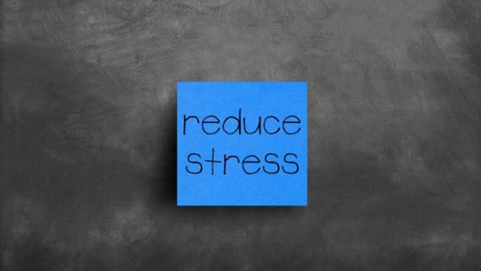 Blue post-it note with Reduce Stress written on it.