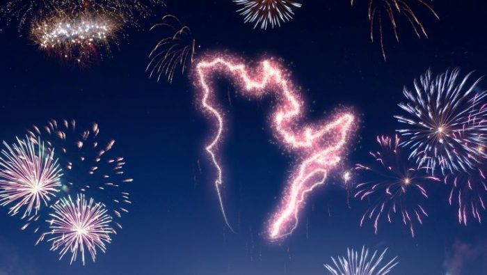 Fireworks in the shape of Quebec in the night sky.