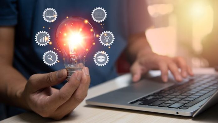 The Most Wanted Entry-Level Skills In 2023 A person over a laptop learning different types of skills as they apply for jobs.