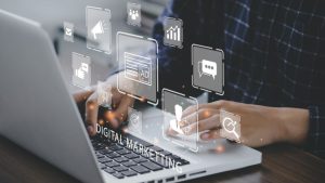 10 Must-Have Digital Marketing Skills - a person typing over a computer interface with the words DIGITAL MARKETING hover in large letters.