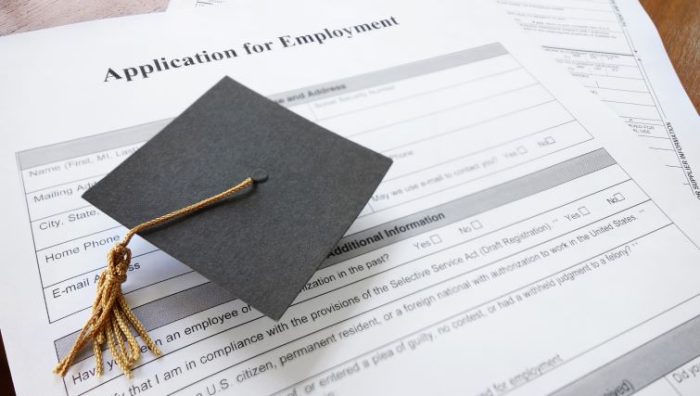 7 Top Entry Level Jobs for 2023 Graduates - A graduation cap on top of a resume.