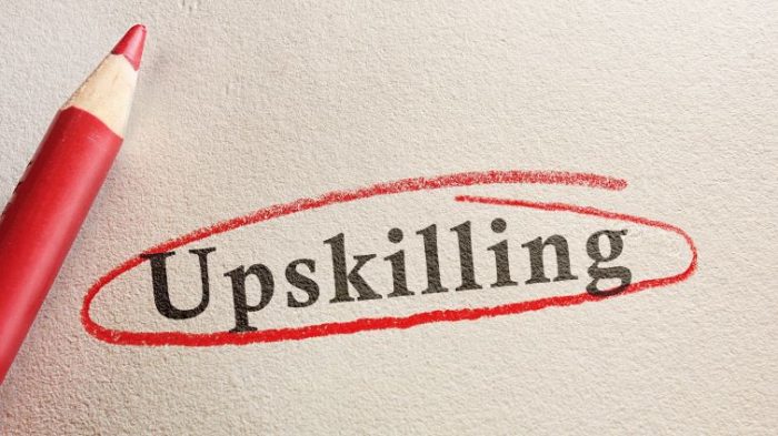 Is Upskilling The Answer To Global Labour Shortages? - the word upskilling written on paper circled in a bright red circle.