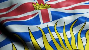 The Minimum Wage in British Columbia In 2023 - flag of British Columbia waving.