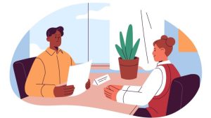 6 Job Interview Tips For New Graduates - a young person interviewing for a job in a bright office.