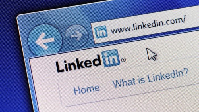 6 Tips to Create a Standout LinkedIn Profile - a laptop open to LinkedIn and ready to create a profile.