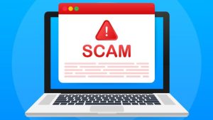 5 Ways to Prevent Yourself Getting Caught in a Fake Job Scam - a laptop with SCAM on screen in large red letters.