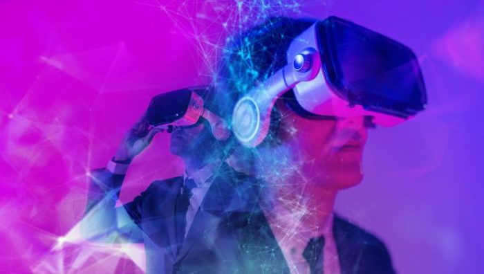 Why Virtual Reality Training is The Future of Company Upskilling - business people wearing vr training headsets in a digital environment.