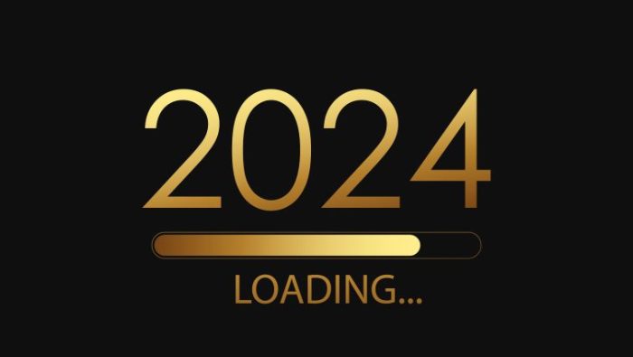102 Professional New Year’s Resolutions in 2024 - the words 2024 loading.... written in large bright font on a dark background.
