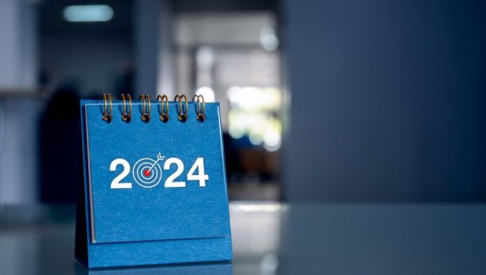 3 Career Resolutions in 2024 - a small desk calendar with 2024 and bullseye on it sitting on an office desk.