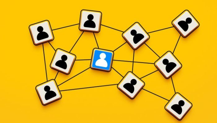 Why Networking Is A Must For Leaders - a series of silhouettes of business people connected in a series of interconnected webs.