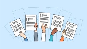 Resume Writing Tips for International Students - a group of people holding resumes in the air in search of a job opportunity.