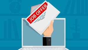 Navigating Job Offers - a job offer being held out from a laptop computer.