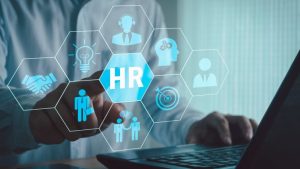 Leveraging Technology for Effective Workforce Management - an HR logo hovering over a laptop computer.
