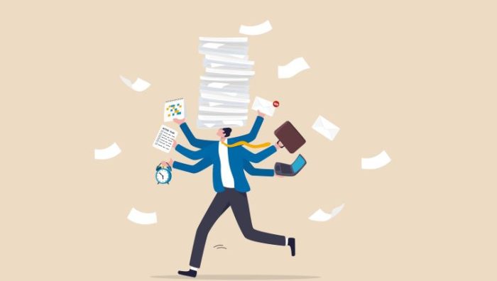 8 Warning Signs of Workaholism: How to Identify it in High Achievers 8 Warning Signs of Workaholism - a business person tries to juggle too many work tasks.